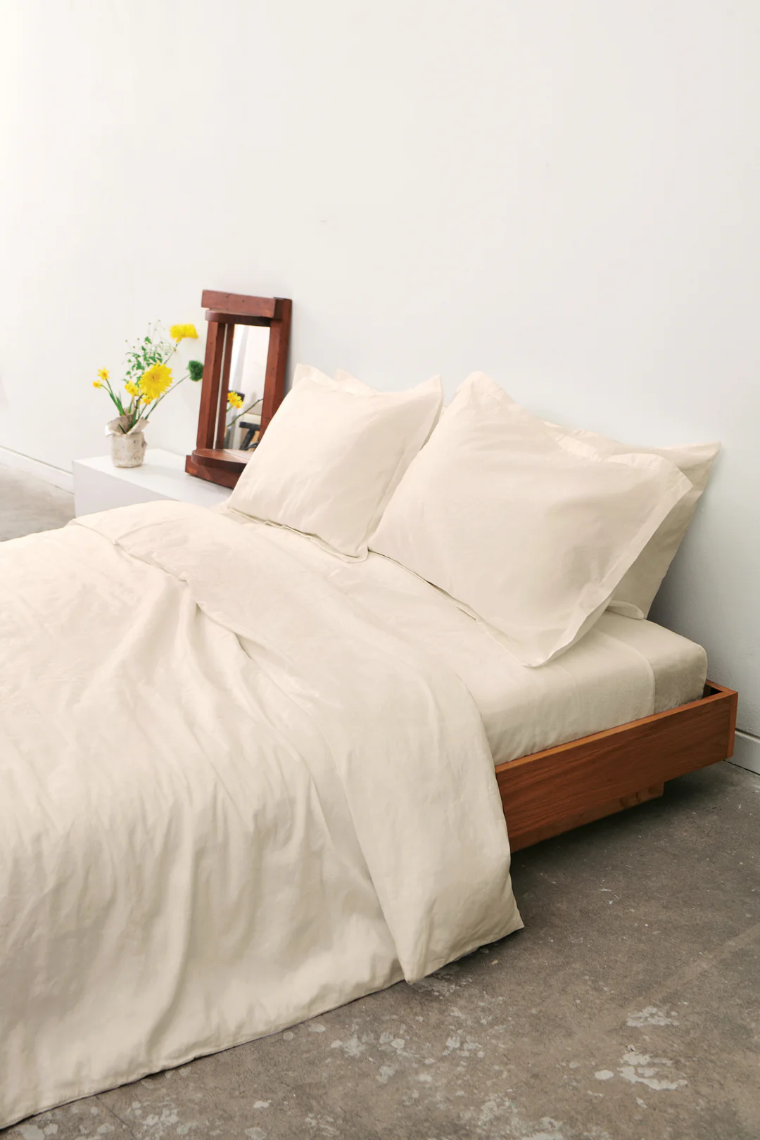 Natural linen duvet cover set on a beautifully made bed